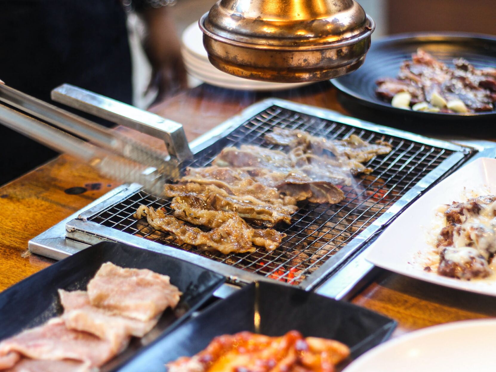 Korean barbecue with a variety of meats and flavors